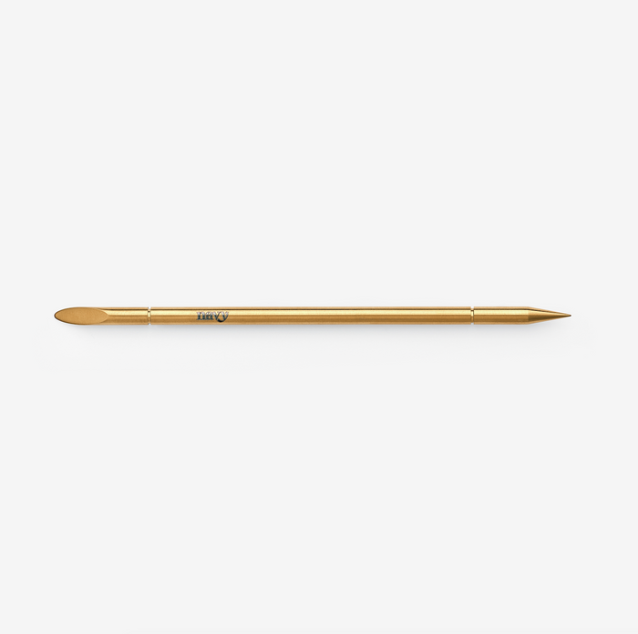 Gold brow and nail multi-tool. Eyebrow and nail prep