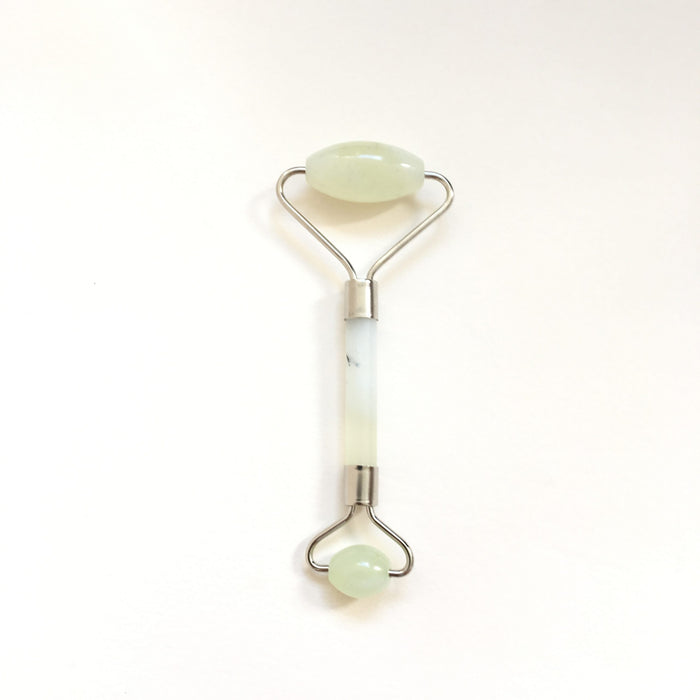 green jade stone roller for facial massage and skincare