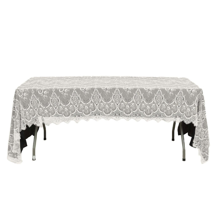 Lace tablecloth on a folding table with a decorative edge