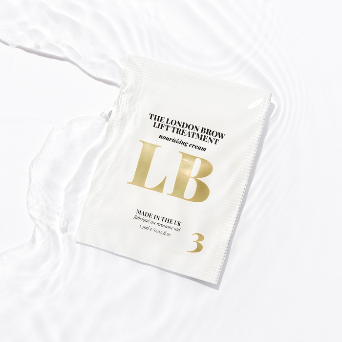 White saschet with gold text and branding on a white background