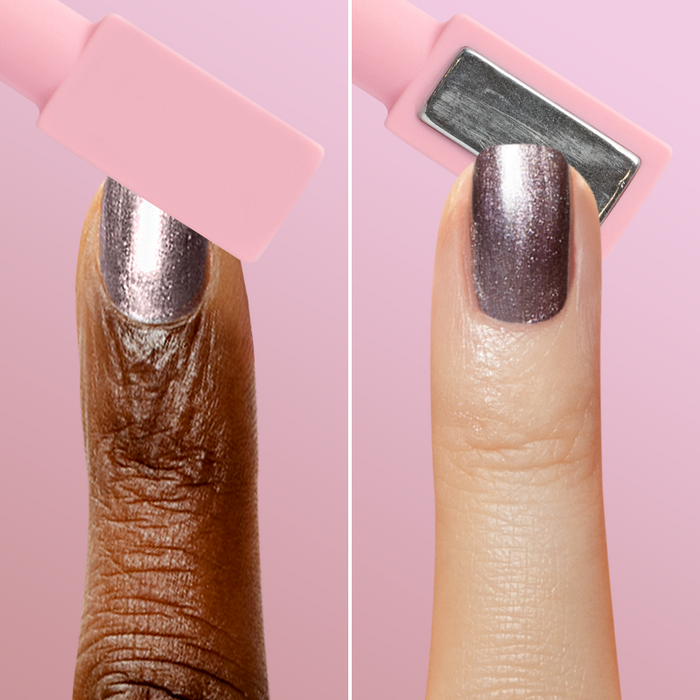Two fingers with metallic polish and pink magnetic wand demonstrating effect from Magnetic Polish Set manicure tools
