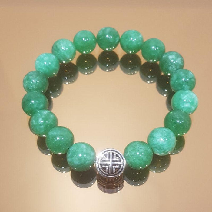 Natural Green Jadeite Jade with Tibetan Silver Bead BraceletThe Bracelet is made of one 8 x12 mm Tibetan silver bead, classically designed men’s bracelet works well with any outfit.
Subtle earth color Natural Green Jadeite JBead BraceletsT.M.JTheodore Men's JewelryNatural Green Jadeite Jade