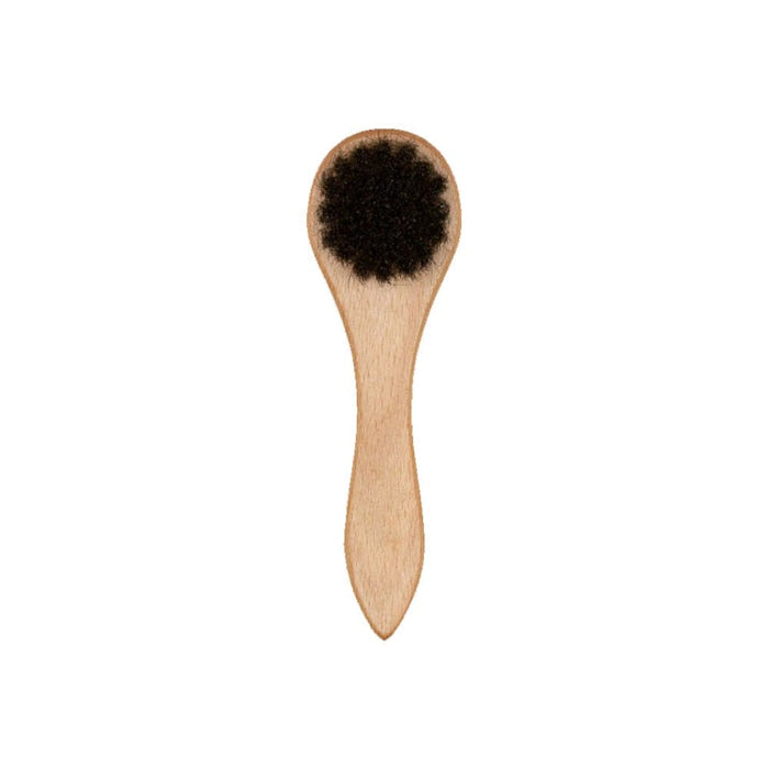 This is a New Era Wooden Cap Brush 2