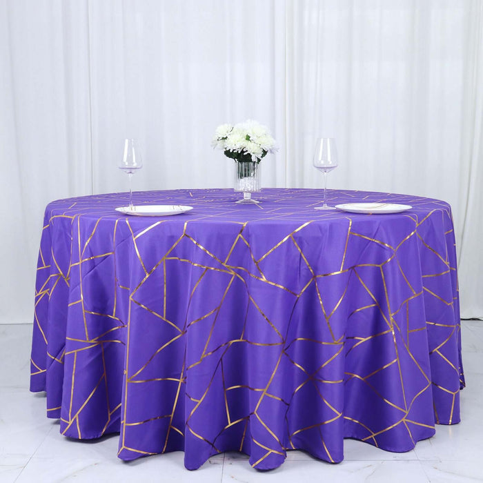 Purple tablecloth with gold geometric patterns, styled for an elegant dining setup.