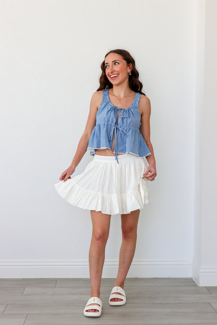 girl wearing short white skirt