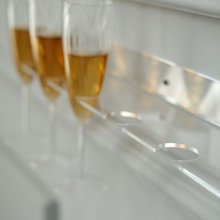 Elegant champagne flutes on a sleek holder for stylish celebrations.
