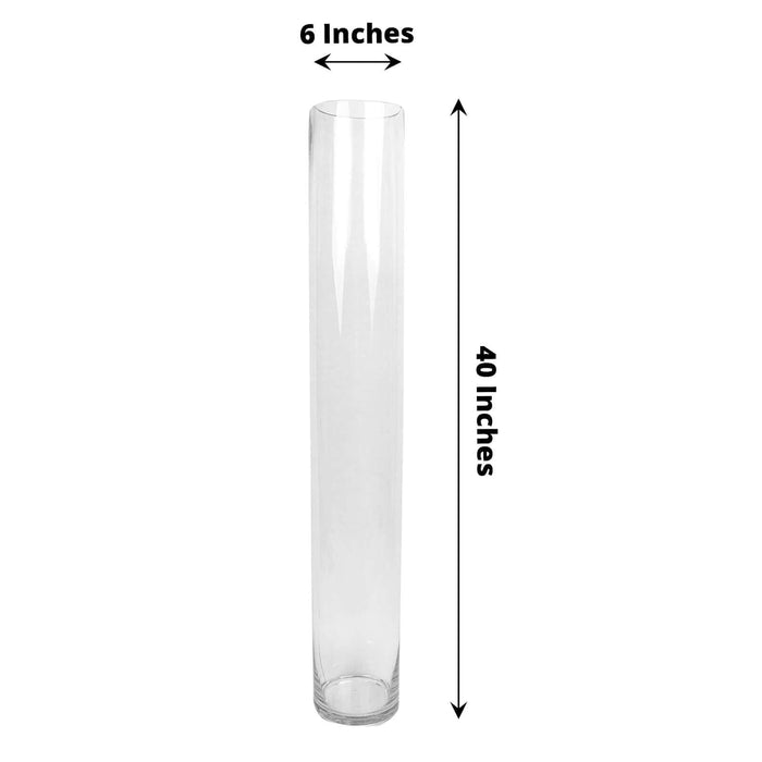 Clear glass vase, 6 inches wide and 40 inches tall.