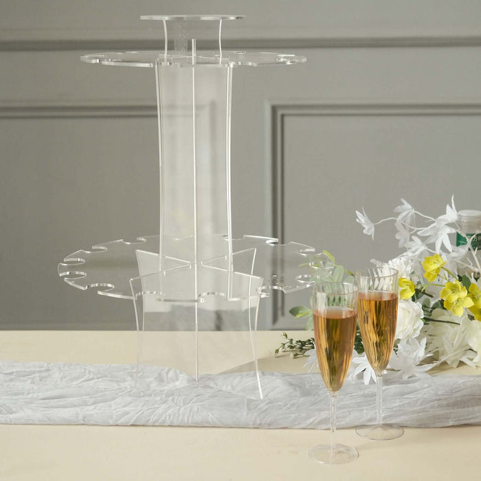 Acrylic drink stand with champagne glasses and flowers.