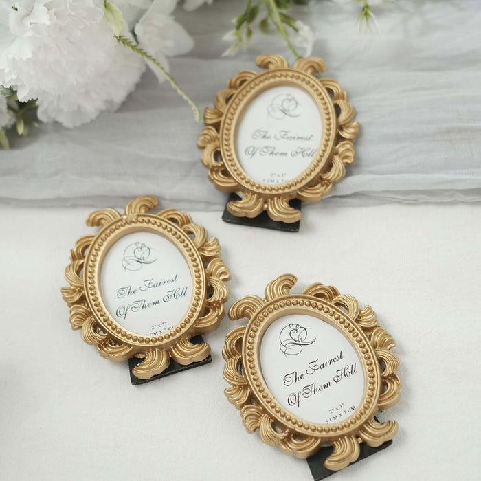 Three ornate gold picture frames displaying "The Fairest of Them All" text.