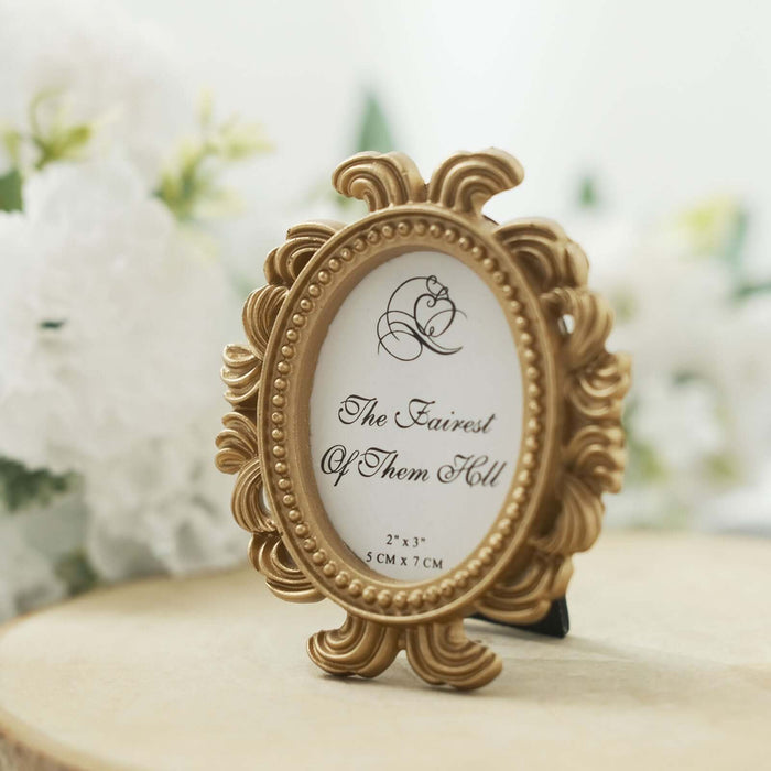 Gold ornate picture frame with "The Fairest of Them All" inscription.