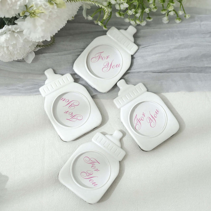 White ceramic coasters with "For You" inscription in pink.
