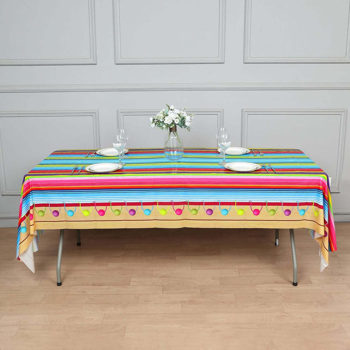 Colorful striped tablecloth with decorative patterns for festive occasions.