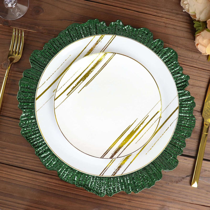 Elegant green and gold decorative plate on a rustic wooden table.