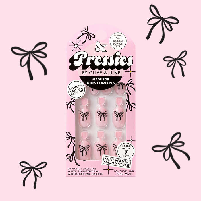 Biggest Bow On Top - Pressies | Short Medium | Round pink press-on nails with black bow design by Olive and June