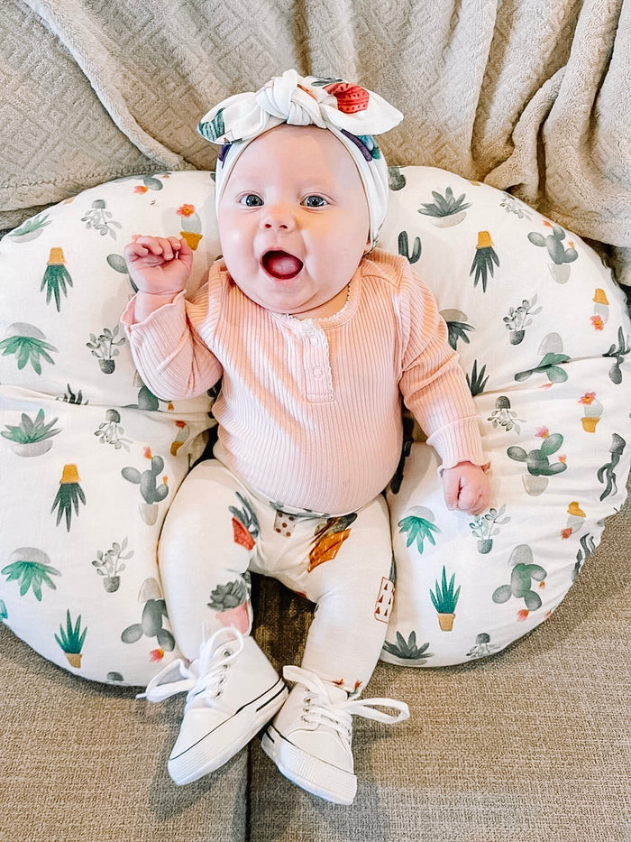 Adorable baby girl leggings with colorful potted cactus designs, perfect for all seasons.