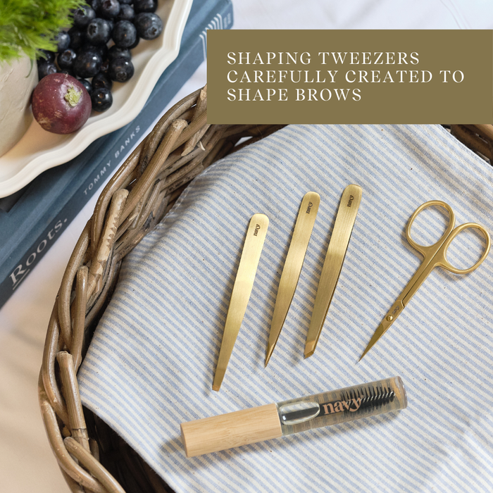 Set of gold shaping tweezers and a small bottle on a textured surface with text overlay.