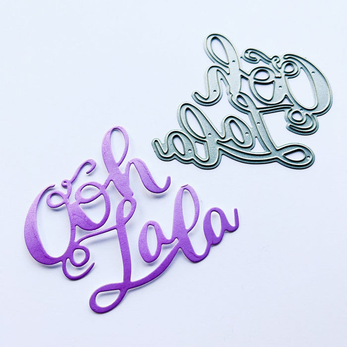Catherine Pooler - Word Die - Ooh LaLa. Ooh Lala, this word die is divine!! The Ooh Lala is a cute addition to a card celebrating exciting news! It pairs perfectly with our Dreaming of France Stamp Set but will also be a cute focal point for a birthday or a fun way to say congrats.  Die measures approx. 2-1/2" x 3". Available at Embellish Away located in Bowmanville Ontario Canada.