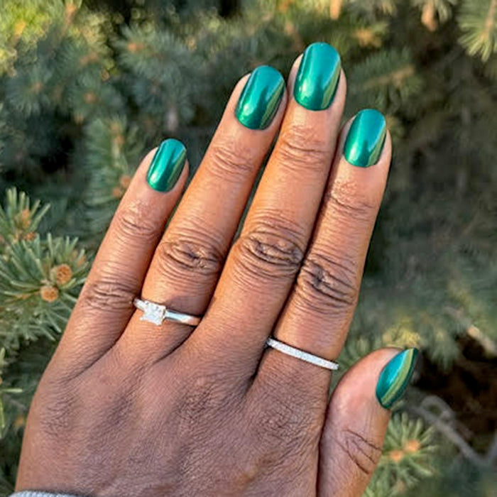 Emerald Velvet - Press-On | Medium | Almond glossy emerald green false nails on hand with silver rings outdoors background