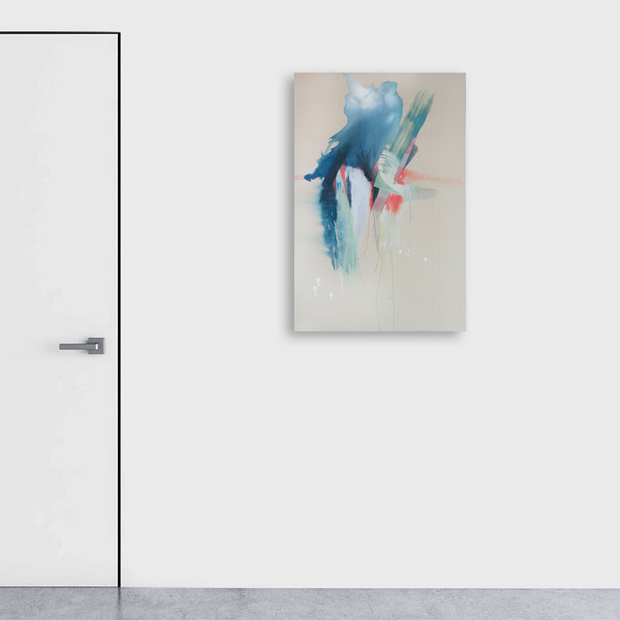 The artwork 'Forces Beyond' features ethereal watercolor strokes in vibrant turquoise blue cascading downward on a light beige canvas, accented with subtle coral pink highlights. Abstract expressionist brushwork creates a dynamic vertical movement, suggesting a fluid, otherworldly presence. 36x24 inches contemporary wall art by Rebecca Stern.