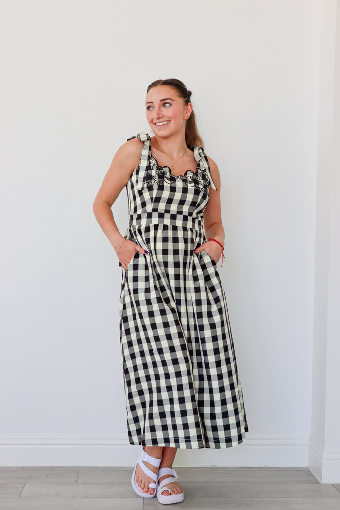 girl wearing black and cream gingham maxi dress