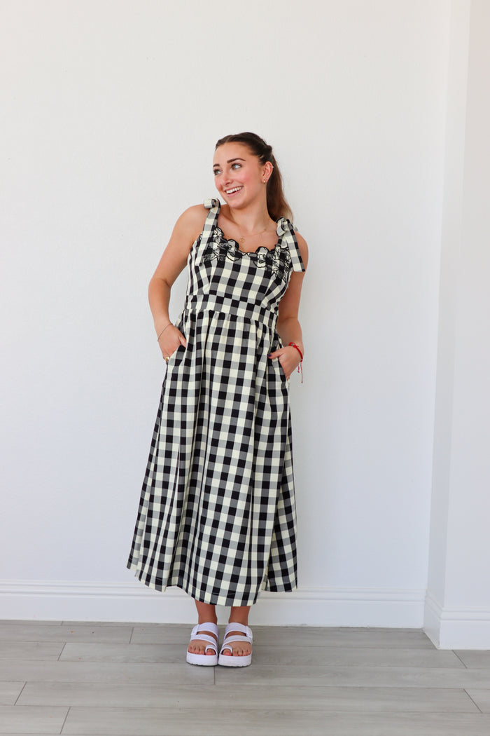 girl wearing black and cream gingham maxi dress