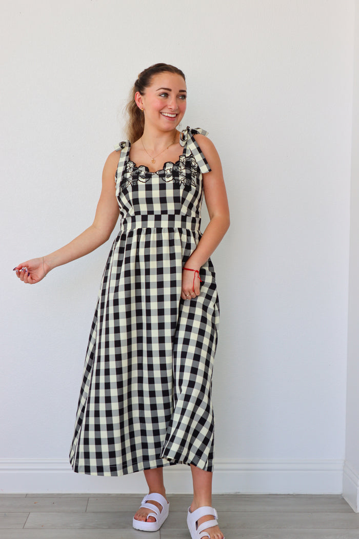girl wearing black and cream gingham maxi dress