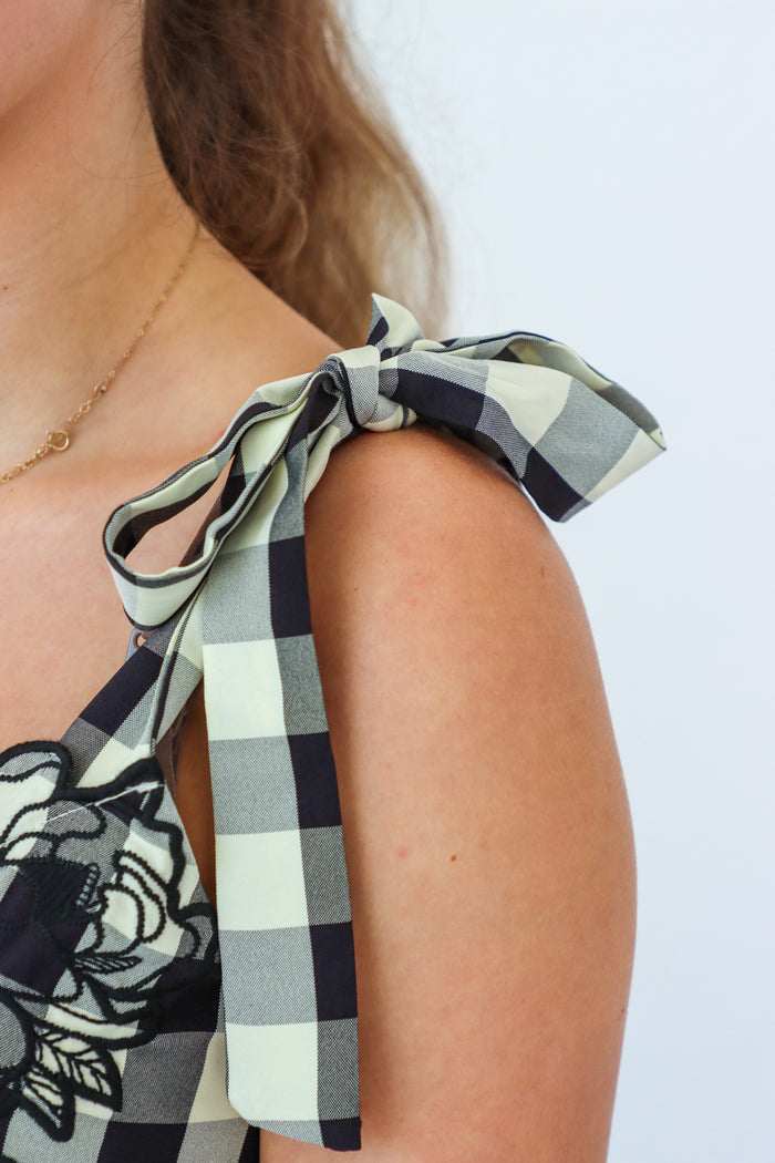 girl wearing black and cream gingham maxi dress