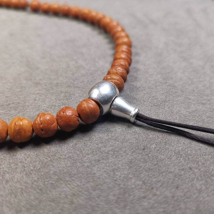 Guru Bead, T-drilled 3-Hole Bead for Prayer Bead - Tibetan Buddhist art, close-up detail