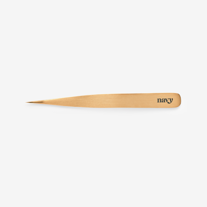 Wooden tool with 'navy' branding on a white background