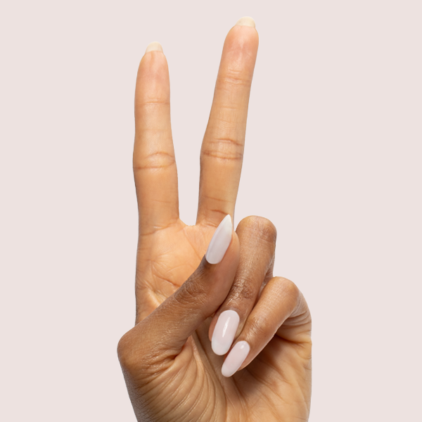 Icing is the Best Part - Gel sheer milky white gel polish on long almond-shaped nails by Olive and June