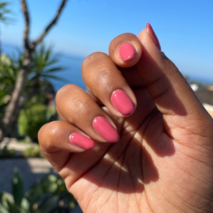 LD - Gel displayed on natural nails in a warm rosy pink shade for a smooth, long-lasting manicure by Olive and June
