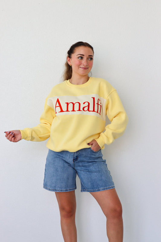 girl wearing yellow "amalfi" crewneck