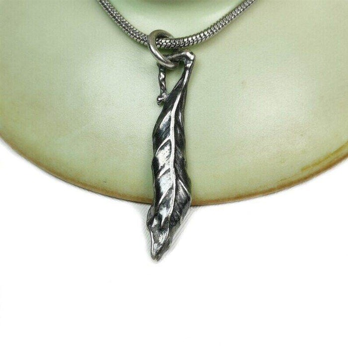 Lucky Charm, Unique Buddha among Leaf,Silver Pendant Amulet - Tibetan Buddhist amulet, close-up detail
