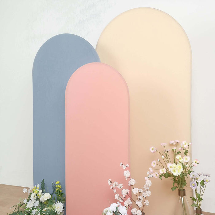 Pastel colored backdrops with flowers in a studio setting.