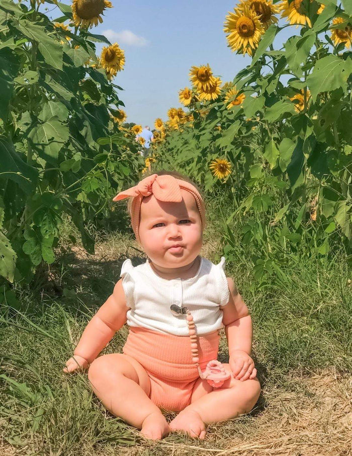 Baby Girl in Melon Ribbed Bummies