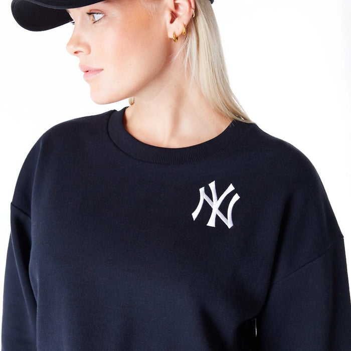 The Female model is wearing New York Yankees Womens MLB League Essential Black Crop Crew Neck Sweatshirt 6