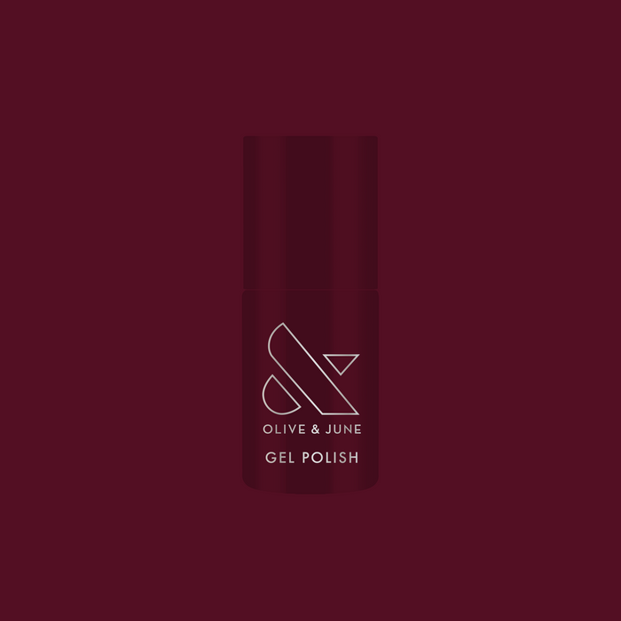 Obsessed - Gel bottle shown in a deep dark ruby shade for a rich, long-lasting gel manicure by Olive and June
