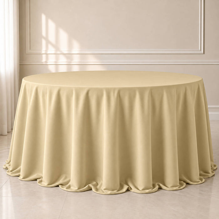 Champagne polyester round tablecloth with seamless finish.
