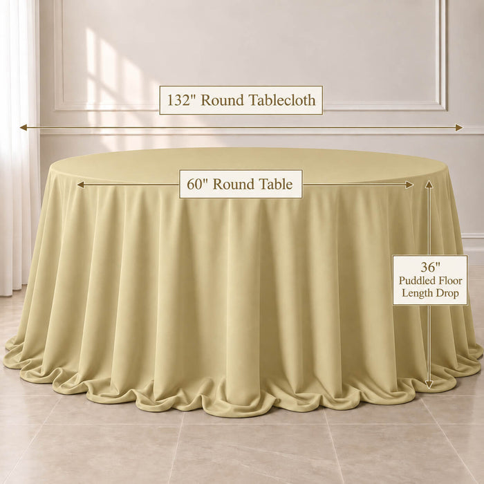 Champagne round tablecloth on a 60" round table with puddled floor length drop.