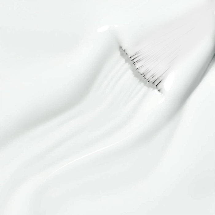 Pure white gel texture smooth self-leveling creamy formula ultra-pigmented close-up with brush