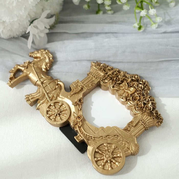 Gold decorative carriage mirror with floral design.