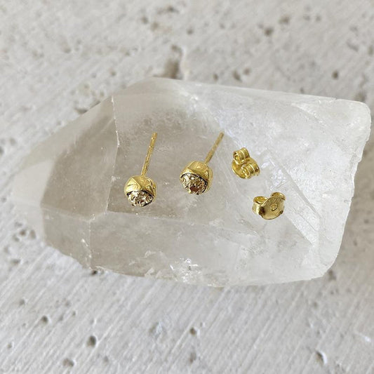 Gold-tone rough pyrite bezel stud earrings with butterfly backs
