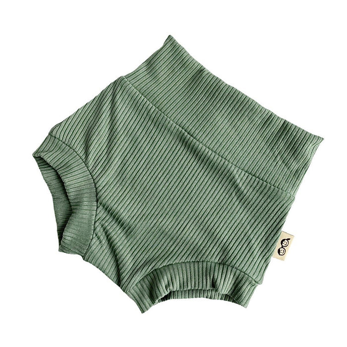 Flat-lay of ribbed green bummies for babies, designed with a high waistband for comfort and style.
