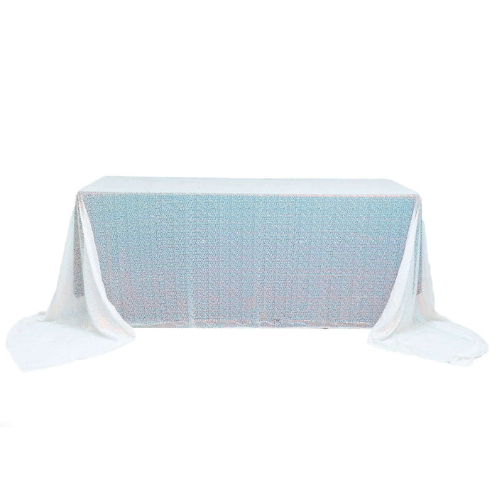 White sequin tablecloth draped over table