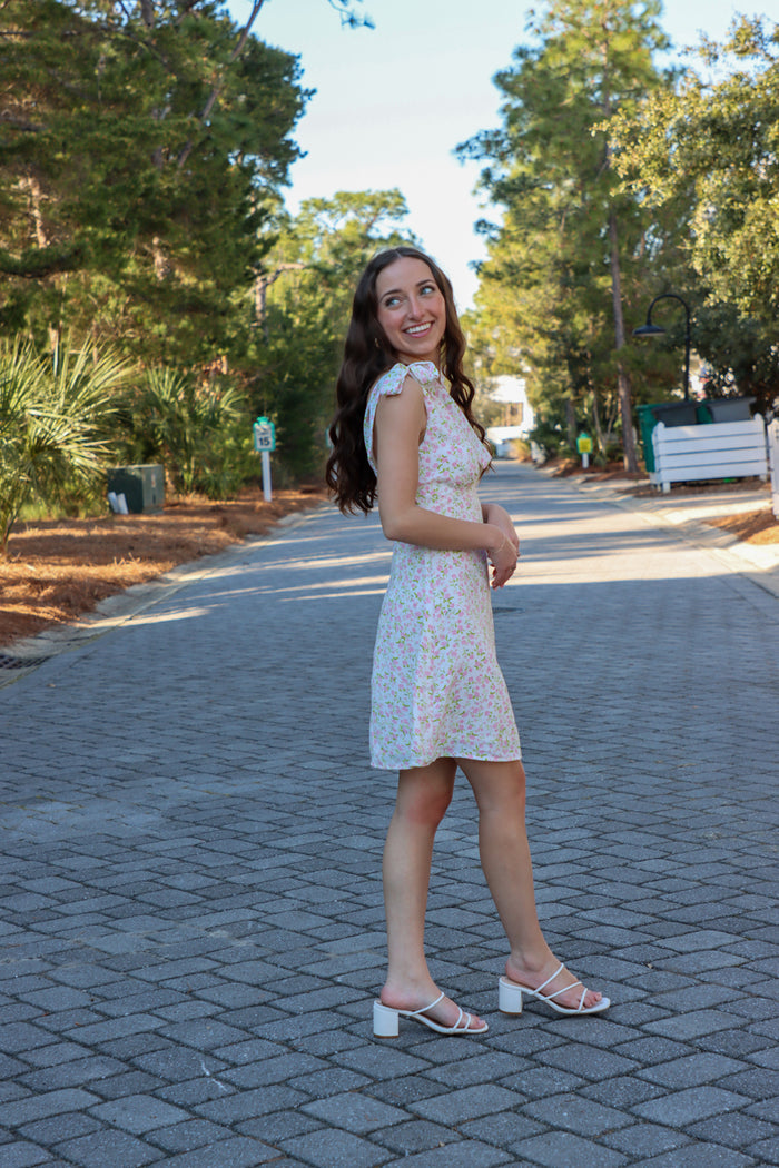 girl wearing light pink floral pink dress