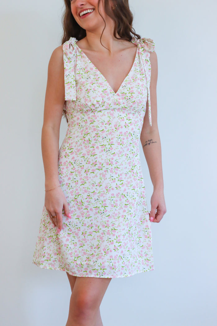 girl wearing light pink floral pink dress