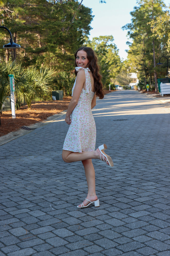 girl wearing light pink floral pink dress