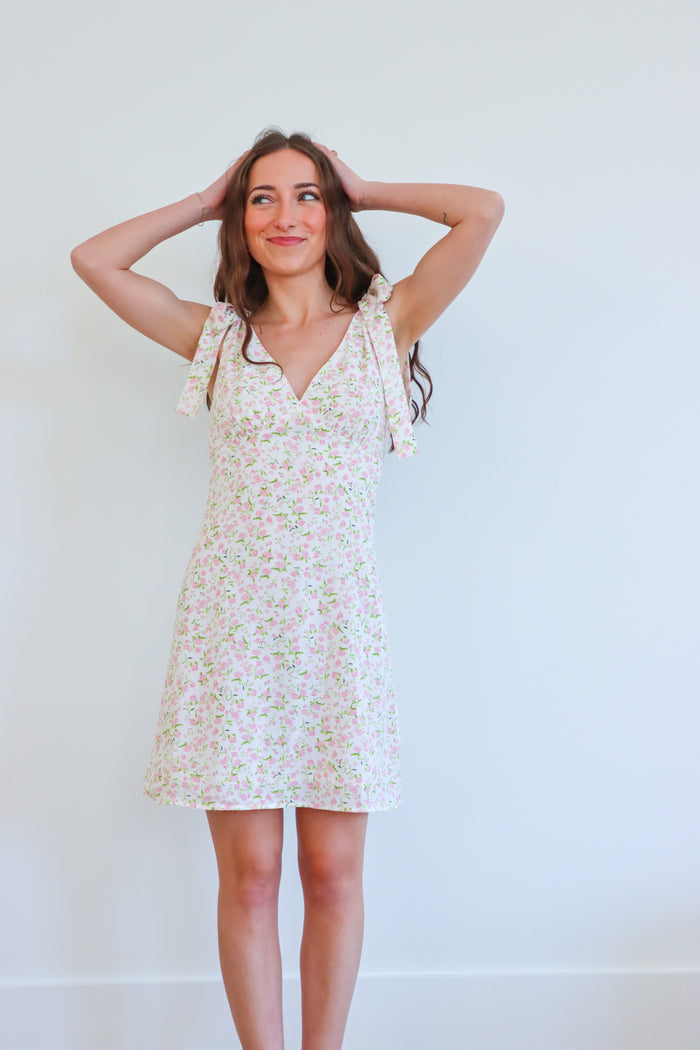 girl wearing light pink floral pink dress