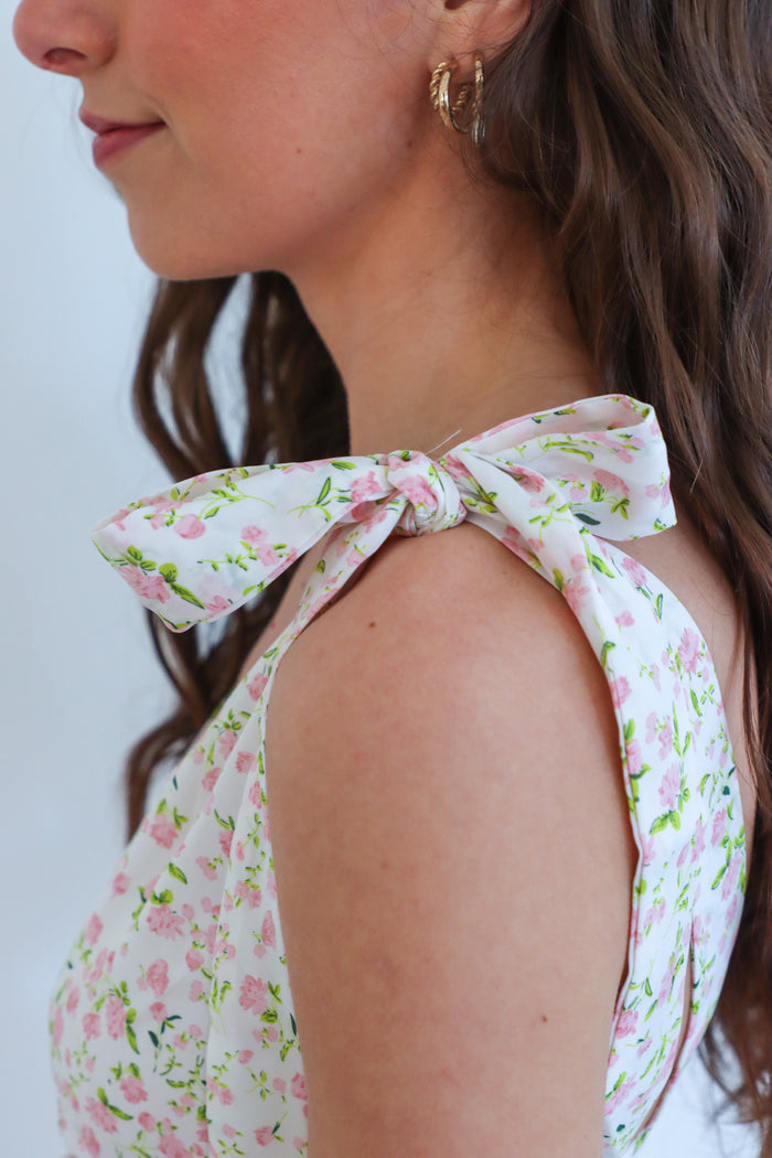 girl wearing light pink floral pink dress