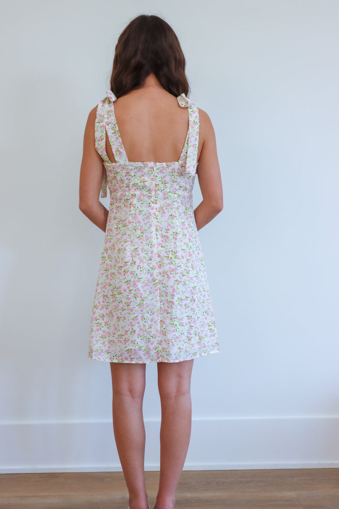 girl wearing light pink floral pink dress
